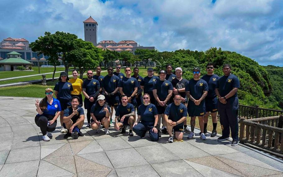 Sailors assigned to Commander, Fleet Activities Okinawa (CFAO), CFAO tenant commands, and U.S. Naval Hospital Okinawa take a group photo.