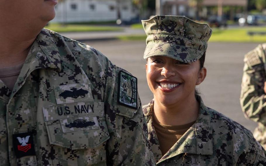 Information Specialist Technitian 1st Class Ritha Monterrosso smiles while in formation in Okinawa.
