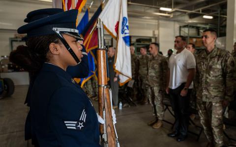 Photo Of U.S. Air Force Senior Airman Nkayla Williams, 18th Wing honor guardsman, presents the colors during the national anthem at the police week closing ceremony held at Kadena Air Base, Japan, May 16, 2025. Police Week is held every year to honor the fallen law enforcement officers who gave their lives in the line of duty. 
