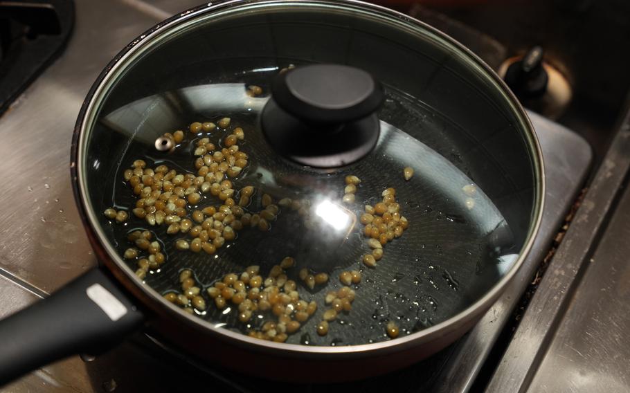 2 Put the pan over medium heat. Make sure you put a lid on the pot while heating.
