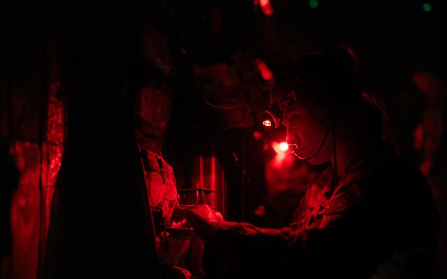 U.S. Air Force Senior Airman Esther Crane, 18th Aeromedical Evacuation Squadron aeromedical evacuation technician, searches through a medical kit during a routine readiness exercise at Kadena Air Base, Japan, May 8, 2025. Members of the 18th AES undergo extensive training to respond to various emergency medical scenarios, ensuring they are prepared to evacuate, treat and transport wounded military and civilian personnel at a moment’s notice. 