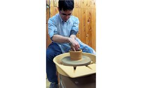 Shoji making pottery.