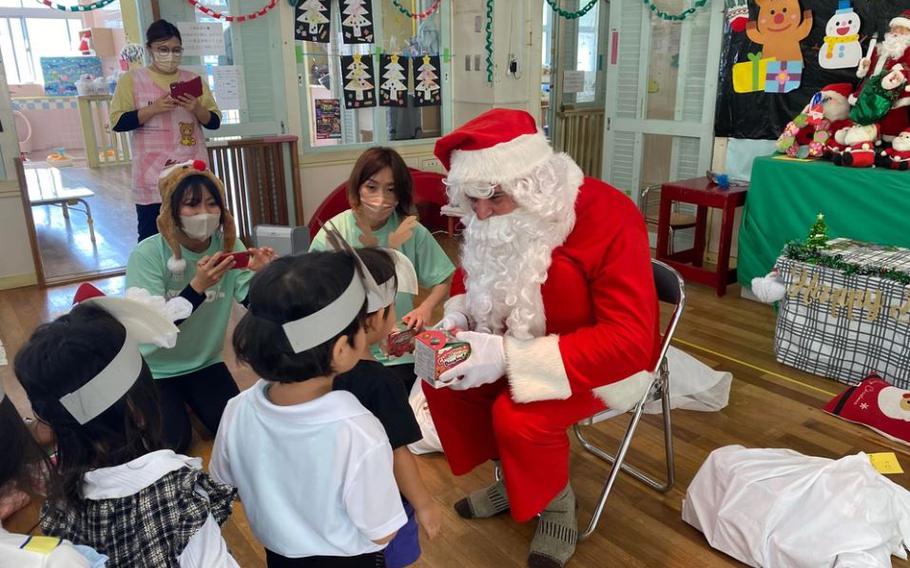 U.S. Marines and Sailors deliver presents during the holiday season to local children at Taguchi Nursery in Okinawa, Japan, Dec. 15, 2023. The Marines and Sailors of 2d Battalion, 2d Marine Regiment dedicated 770 hours to community service during their six-month deployment in Okinawa. The battalion contributed to the local community by cleaning up trash on local beaches, provided English lessons at local schools and sponsored a foster home during the holiday season. 2/2 is forward deployed in the Indo-Pacific under 4th Marine Regiment, 3d Marine Division as part of the Unit Deployment Program.