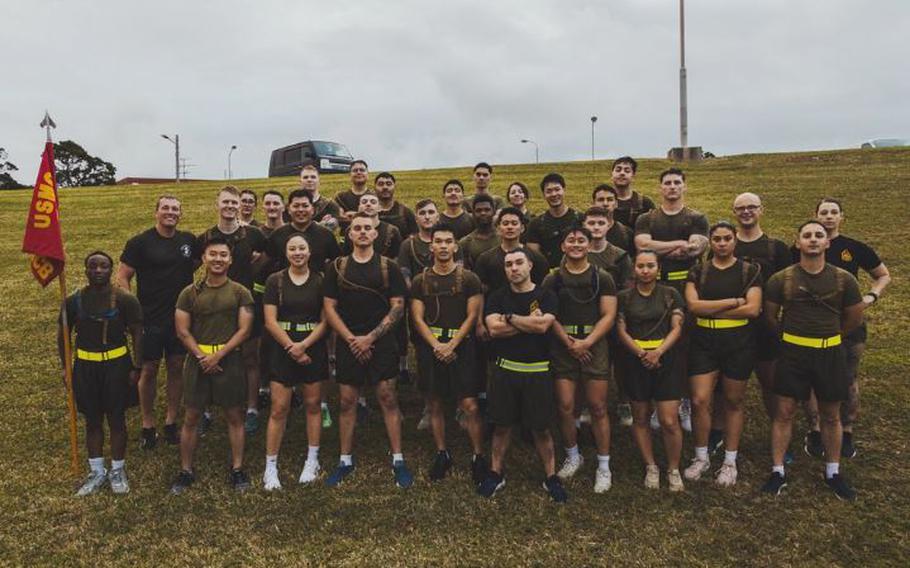 U.S. Marines pose for a group photo with Medal of Honor recipient Dakota Meyer on Camp Foster, Okinawa, Japan, Feb. 27, 2024. Meyer, one of the three Marines who were awarded the Medal of Honor during the Global War on Terror, visited Okinawa to address service members about his Marine Corps experiences, leadership, transition readiness, and mental health.