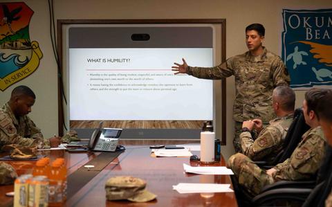 Photo Of U.S. Air Force Senior Airman Anthony Jimenez presents his slides at Kadena Air Base.