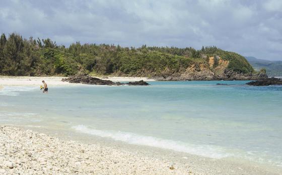 Photo Of A man with swimming wear enjoying the beach.