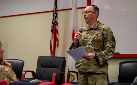 Photo Of Chief Master Sgt. Shaun Campbell briefs during a bilateral senior enlisted leadership training.