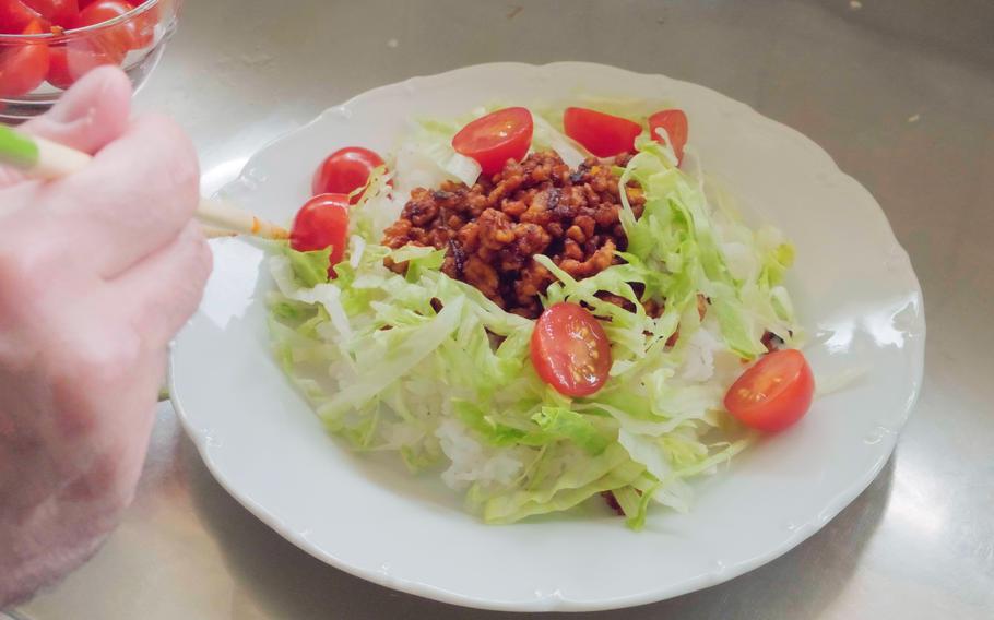 Serve up rice and a plate and top it with the fried mixture and other toppings such as sliced cherry tomatoes, cheese, and lettuce.