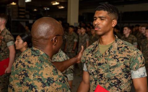 Photo Of U.S. Marine Corps Cpl. Zacaiah Cooper is awarded the Navy and Marine Corps Achievement Medal.