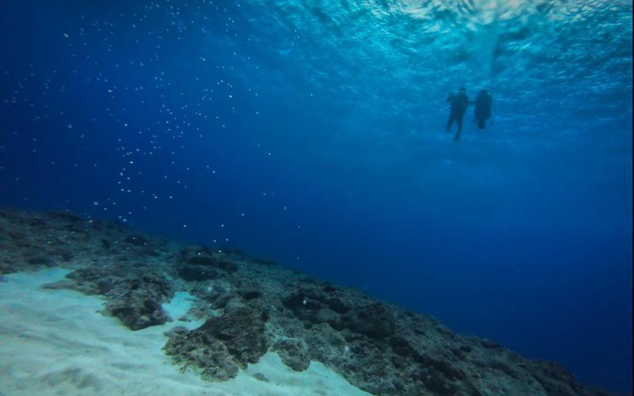 two divers can be seen.