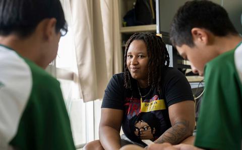 Photo Of Aircrew Survival Equipmentman Airman Briana Cook, from Miami, assigned to the “Golden Eagles” of Patrol Squadron (VP) 9, participates in a language exchange with Okinawan students.