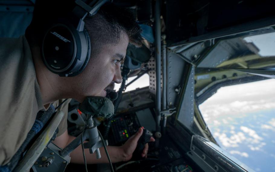 U.S. Air Force Senior Airman Andre Jimenez-Guzman refuels a U.S. Navy F/A-18 Super Hornet.