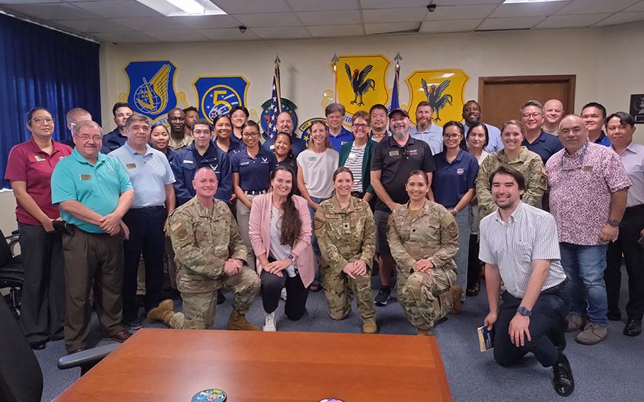 Kadena FSS group photo with Stars and Stripes Pacific staff