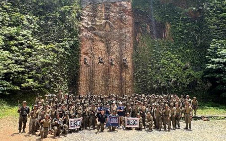 USO Staff (Center Operations Coordinator Jeff Pitt and Center Operations Specialist Abbie Matherne), leaders of 2nd Battalion 23rd Marines, Jungle Warfare Training Center staff and Marines of 2-23.
