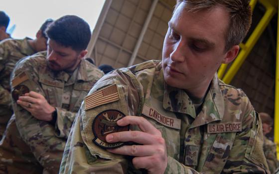 Photo Of U.S. Air Force Senior Airman Kelsey Cavender, 21st Special Operations Aircraft Maintenance Squadron CV-22 crew chief, applies the new 21st SOAMXS patch on his uniform during the 753rd SOAMXS redesignation ceremony at Yokota Air Base, Japan, June 21, 2024. The 753rd SOAMXS was redesignated as the 21st SOAMXS in line with Air Force Special Operations Command’s strategic vision and operational imperatives. This effort optimizes unit and individual readiness, collaboration and combat effectiveness between the 21st SOAMXS and 21st Special Operations Squadron.
