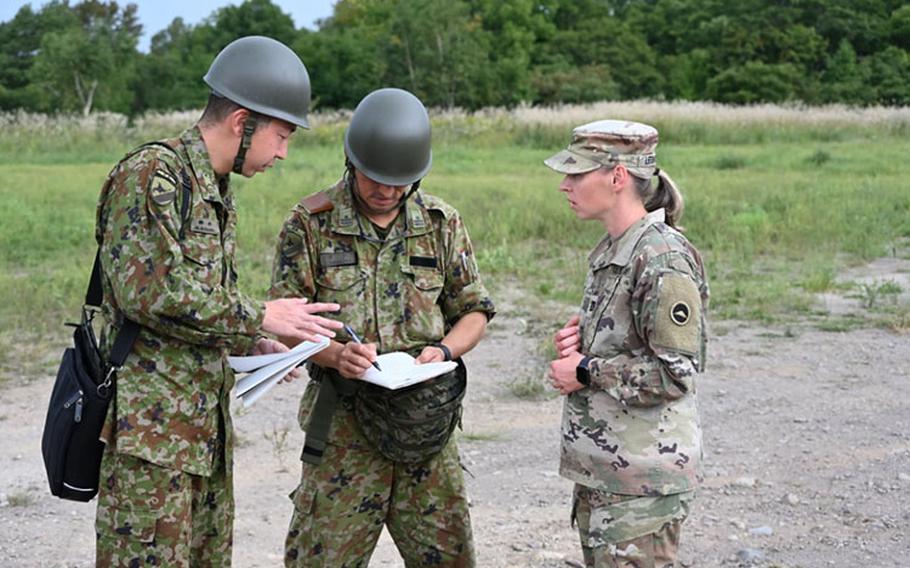 U.S. Army Capt. Alena Leshchyk, a Belarusian native, works with her Japanese Ground Self-Defense Force bilateral partners to establish an Ammunition Holding Area during Exercise Orient Shield 23 at Camp Kamifurano on Sept. 12. Orient Shield is the largest annual bilateral training exercise conducted in Japan between the Japanese Ground Self-Defense Forces and the U.S. Army.