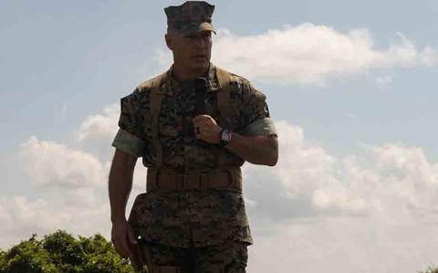 Photo Of U.S. Marine Corps Col. Mastin M. Robeson Jr, oncoming commanding officer of Headquarters Battalion, 3d Marine Division, gives remarks during a change of command ceremony on Camp Courtney, Okinawa, Japan.
