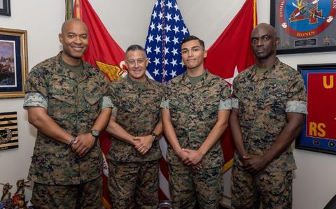 Photo Of U.S. Marine Corps Sgt. Maj. Imhotep Woodby, left, sergeant major of Combat Logistics Regiment 37 (CLR-37), 3rd Marine Logistics Group (MLG), Brigadier General Adam Chalkley, center left, the commanding general of 3rd MLG, Lance Cpl. Cruz Mendez, center right, a financial technician with CLR-37, 3rd MLG, and Master Gunnery Sgt. Winston Small, right, a disbursing chief with CLR-37, 3rd MLG, pose for a photo on Camp Kinser, Okinawa, Japan, May 2, 2024.