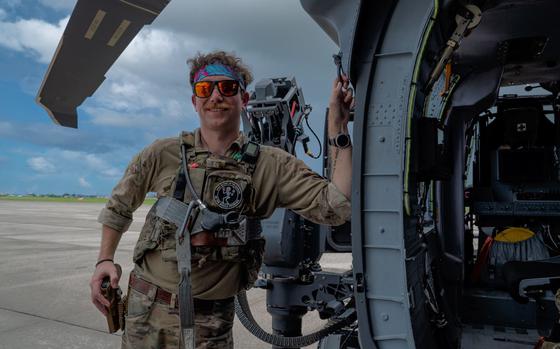 U.S. Air Force Staff Sgt. Cody Usher, 33rd Rescue Squadron special missions aviator, takes a break after performing preflight inspections on an HH-60W Jolly Green II at Kadena Air Base, Japan, July 17, 2024.