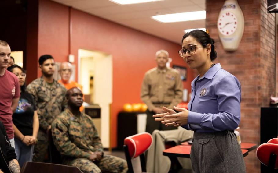 Madisa Marlor, director of the Navy-Marine Corps Relief Society Okinawa, gives remarks on Camp Foster, Okinawa, Japan, March 1, 2024. The Active Duty Fund Drive bowling tournament signals the start of the Navy-Marine Corps Relief Society fundraising period that runs from March 1 to April 15. Service members can contact their unit representatives to donate or visit https://www.nmcrs.org. Marlor is a native of Saipan.