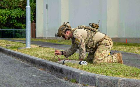 Photo Of U.S. Air Force Senior Airman Gio Varano, Explosive Ordnance Disposal technician with the 18th Civil Engineer Squadron, conducts a removal of a simulated unexploded ordnance during a routine readiness exercise at Kadena Air Base, Japan, Jan. 14, 2025.