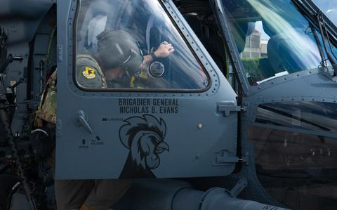 Photo Of U.S. Air Force Brig. Gen. Nicholas Evans, 18th Wing commander, climbs into a HH-60W Jolly Green II before his final sortie with the 33rd Rescue Squadron at Kadena Air Base, Japan.