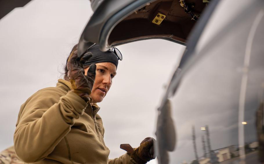 U.S. Air Force Tech. Sgt. Shelby ‘Scar’ Duncan, 33rd Rescue Squadron special missions aviator, performs pre-flight checks on an HH-60W Jolly Green II before its first flight at Kadena Air Base, Japan, Feb. 27, 2024. The HH-60W is designed for mission critical operations to include personnel recovery, humanitarian missions, civil search and rescue, disaster relief, medical evacuations and non-combatant evacuations.