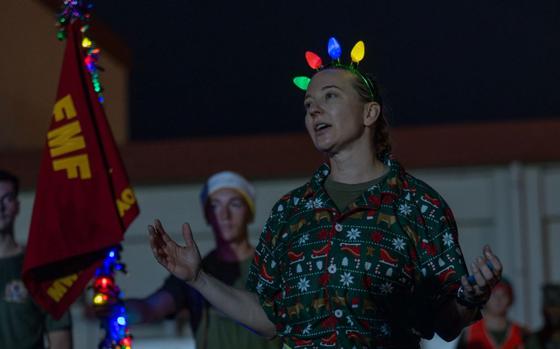 U.S. Marine Corps Lt. Col. Nicole Penn, commanding officer of Marine Wing Support Squadron 172, Marine Aircraft Group 36, 1st Marine Aircraft Wing, speaks to the unit after a holiday fun run on Camp Foster.