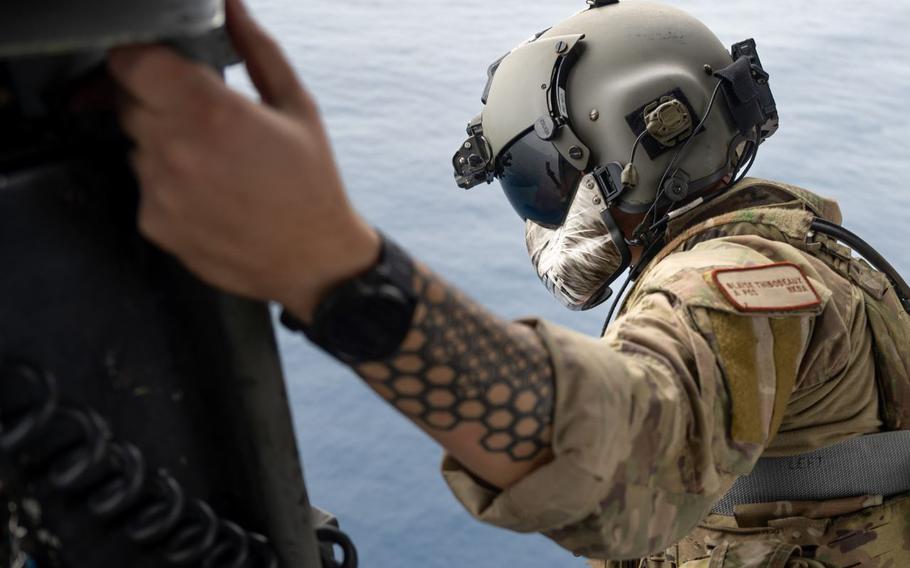 U.S. Air Force Senior Airman Blaise Thibodeaux, 33rd Rescue Squadron special missions aviator, looks out over the Pacific Ocean during a formation flight off the coast of Okinawa, Japan, April 16, 2024. Special missions aviators perform a multitude of duties including pre-flight inspections, managing weight distribution and placement of passengers and cargo, and coordinating employment of weapons and defensive systems.