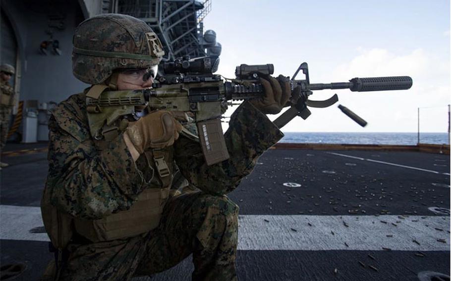 U.S. Marine Corps Lance Cpl. Claudia Murphy, a mortarman with Battalion Landing Team 3/5, 31st Marine Expeditionary Unit (MEU), conducts a deck shoot aboard amphibious assault ship USS America (LHA 6), in the Pacific Ocean, July 14, 2021. The deck shoot consisted of Marines practicing a series of shooting drills to maintain weapons proficiency. The 31st MEU is operating aboard ships of the America Expeditionary Strike Group in the 7th fleet area of operations to enhance interoperability with allies and part