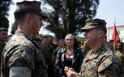 Photo Of U.S. Marine Corps Sgt. Brenden Kuhlmann, left, is meritoriously promoted to Staff Sgt. by Col. Peter Eltringham on Camp Hansen, Okinawa, Japan, April 11, 2024.