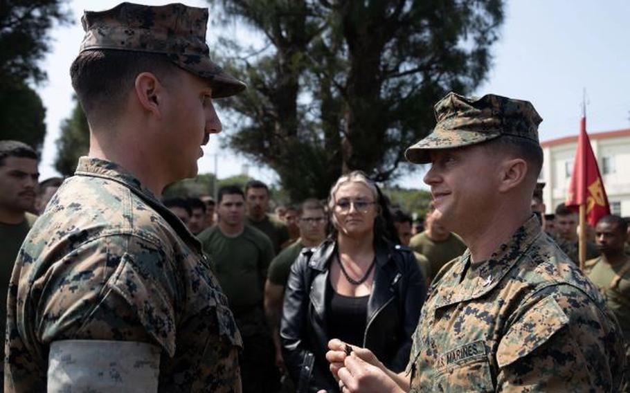 U.S. Marine Corps Sgt. Brenden Kuhlmann, left, is meritoriously promoted to Staff Sgt. by Col. Peter Eltringham on Camp Hansen, Okinawa, Japan, April 11, 2024. Kuhlmann was meritoriously promoted to staff sergeant for superior performance in his occupational specialty and as recognition of his ability to assume positions of greater authority and responsibility. Kuhlmann, a native of Alaska, is an artillery electronics technician and Eltringham, a native of Rhode Island, is the commanding officer, both with 12th Marine Littoral Regiment, 3d Marine Division.