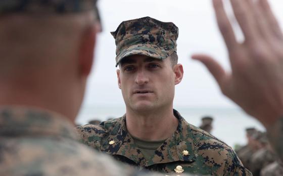 Photo Of U.S. Marine Corps Major Kevin Moriarty recites the oath of office during his promotion ceremony on Camp Schwab, Okinawa, Japan.