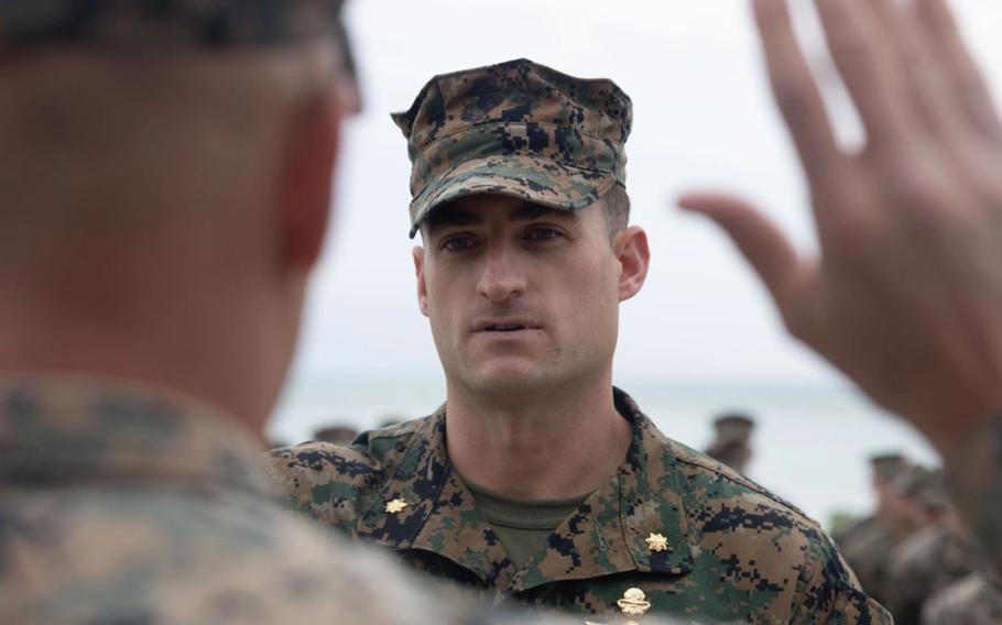 U.S. Marine Corps Major Kevin Moriarty recites the oath of office during his promotion ceremony on Camp Schwab, Okinawa, Japan.