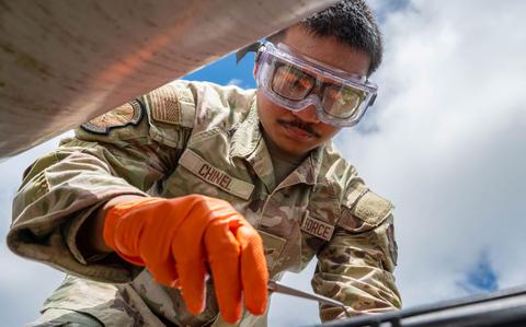 Photo Of U.S. Air Force Airman 1st Class Gage Chinel, 18th Logistic Readiness Squadron laboratory technician, gathers raw fuel samples from a Defense Logistic Agency pipeline.