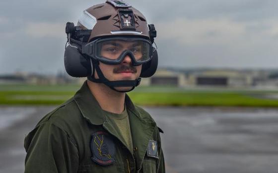 Photo Of U.S. Marine Corps Cpl. Ty Tipton, a fixed wing aircraft mechanic with Marine Fighter Attack Squadron 242, Marine Aircraft Group 12, 1st Marine Aircraft Wing, looks at the camera before directing an F-35B Lightning II aircraft as it returns to Kadena Air Base, Okinawa, Japan, July 26, 2024.