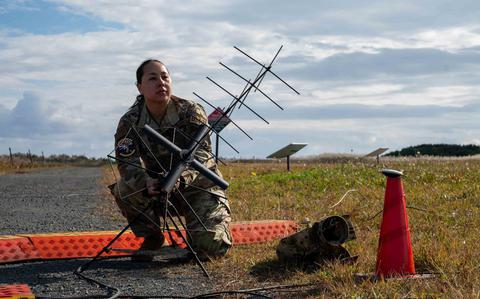 Photo Of U.S. Air Force Tech. Sgt. Sherraye Carter, 623rd Air Control Squadron noncommissioned officer in charge of command and control integrations, assembles a strategic communications antenna during Keen Sword 25 at Misawa Air Base, Japan, Oct. 28, 2024.