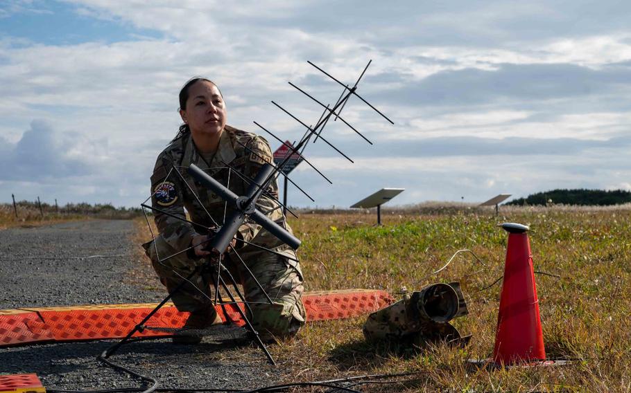 U.S. Air Force Tech. Sgt. Sherraye Carter, 623rd Air Control Squadron noncommissioned officer in charge of command and control integrations, assembles a strategic communications antenna during Keen Sword 25 at Misawa Air Base, Japan, Oct. 28, 2024.