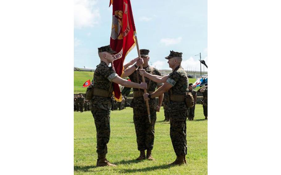 U.S. Marine Corps Maj. Gen. Jay Bargeron, right, passes the 3d Marine Division colors to Maj. Gen. Christian Wortman during a change of command ceremony on Camp Courtney, Okinawa, Japan, June 30, 2023. The ceremony signified the official transfer of command of 3d Marine Division from Maj. Gen. Bargeron to Maj. Gen. Wortman. (U.S. Marine Corps photo by Sgt. Jennifer Andrade)