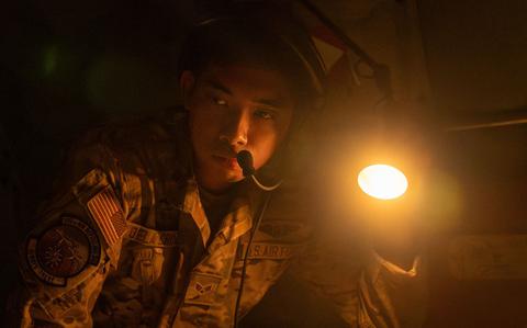 Photo Of U.S. Air Force Landren Dela Crus, 909th Air Refueling Squadron boom operator, performs pre-flight inspections before takeoff at Kadena Air Base, Japan.