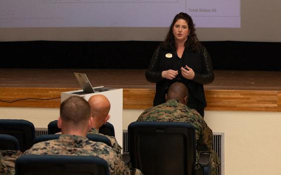 Photo Of Christina Glisson, the deployment readiness coordinator of Combat Logistics Regiment 37, 3rd Marine Logistics Group (3rd MLG), speaks during a Korean Marine Exchange Program pre-deployment brief at Camp Kinser, Okinawa.