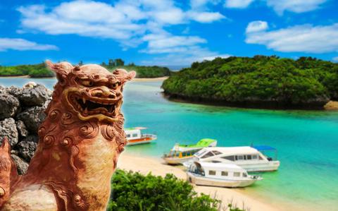 Photo Of Okinawa ocean and shisa statue