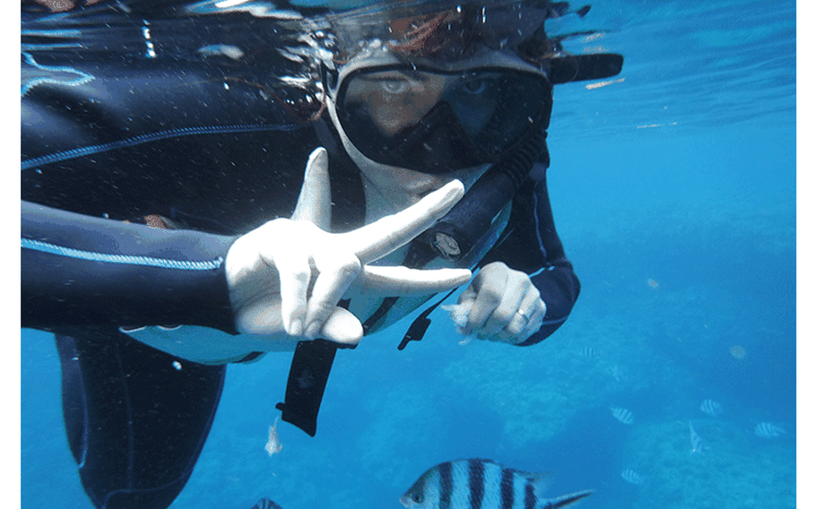 When you go snorkeling at Blue Cave, some tours also provide you the opportunity to feed and get a closer look at the fish that live here. Photos by Shoji Kudaka, Stripes Okinawa