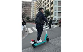 A man riding e-scooter