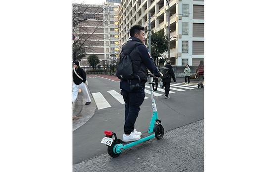 Photo Of A man riding e-scooter